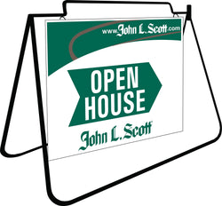 The sign is displayed hanging on a black frame. The top quarter of the sign has a green background with the grey graphic element. The upper right hand corner shows in white text www.JohnLScott.com. Below the top graphic elements a green arrow spans across with the words open house staked inside the arrow in white text. Under the arrow is the John L Scott logo in green.